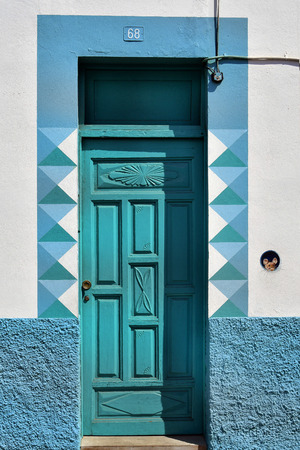 Tenerife, Canary Islands, Spain - April 03, 2018: Home with colorful facade and funny mouse painting in La Ranilla district in Puerto de la Cruzのeditorial素材