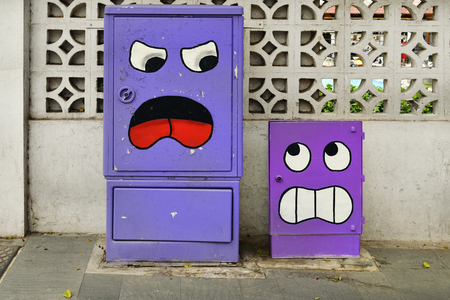 Tenerife, Canary Islands, Spain - April 01, 2018:  Painted boxes for telefon and electricity in a...