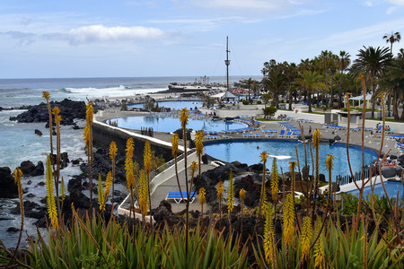 Tenerife, Canary Islands, Spain - April 01, 2018: Unidentified people in Lago di Martianez a feel-good oasis with pools, restaurants and cafe in Puerto de la Cruzのeditorial素材