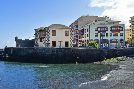 Tenerife, Canary Islands, Spain - April 03, 2018:  Unidentified people and buildings on tiny beach Playa del Muelle in Puerto de la Cruzのeditorial素材