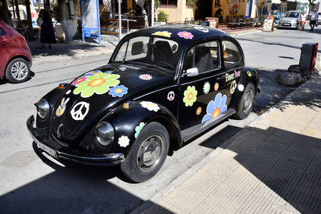 Matala, Greece - October 07, 2018: Beetle car as reminiscence to former flower power generation in the village in the south of Creteのeditorial素材