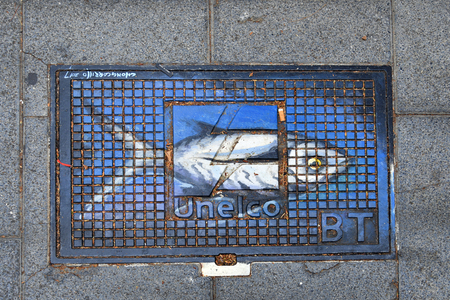 Tenerife, Canary Islands, Spain - April 01, 2018:  Painted manhole cover in a street of Puerto de la Cruzのeditorial素材