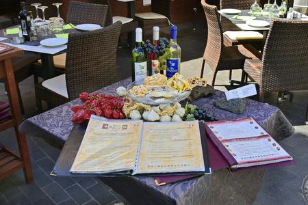 Tenerife, Canary Islands, Spain - April 03, 2018: Table in Restaurant decorated with food and menu card in La Ranilla district in Puerto de la Cruzのeditorial素材