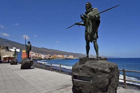 Tenerife, Canary Islands, Spain - April 06, 2018: Coast on Atlantic ocean with bronze sculptures made from sculptor Jose Abad in village Candelariaのeditorial素材
