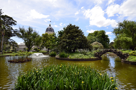 Australia, Melbourne, public Carlton Gardens with pond and Royal Exhibition buildingのeditorial素材