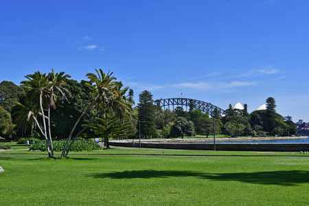 Sydney, NSW, Australia - October 28, 2017: unidentified sporty people in Royal Botanic Garden on Farm cove with Opera and Harbour bridge in backgroundのeditorial素材