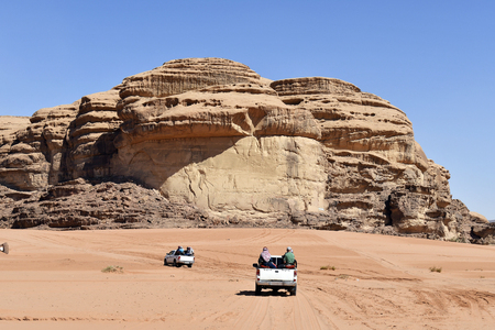 Jordan, Unidentified tourists in cars to explore the great scenery of Wadi Rumの写真素材