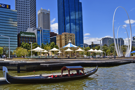 Perth, WA, Australia - November 30, 2017: Venetian gondola, carousel, Spanda sculpture and buildings on Elezabeth Quay in the capital from Western Australiaのeditorial素材