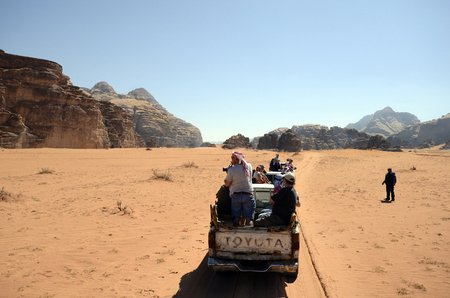 Wadi Rum, Jordan - March 07, 2019: Unidentified tourists in pick-up car, usual mode of transport in Middle Eastのeditorial素材