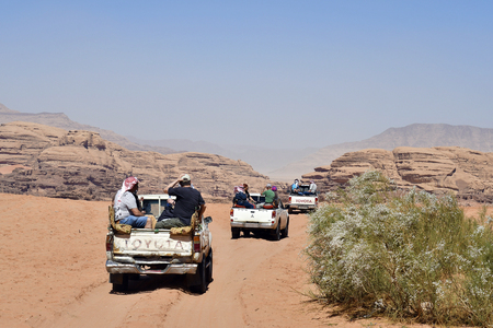Wadi Rum, Jordan - March 07, 2019: Unidentified tourists on pick-up cars, usual mode of transport in Middle Eastのeditorial素材