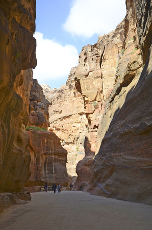 Petra, Jordan - March 06, 2019: Unidentified tourists in canyon named the Siq, way to ancient Petraのeditorial素材