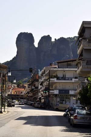 Kastraki, Greece - June 08, 2019: Buildings and traffic in the village of Kastraki with rocks of Meteora in backgroundのeditorial素材