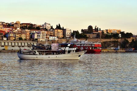 Kavala, Greece - September 27, 2019: Fishing boat leaving the harbor of the city in Eastmacedonia on Aegean seaのeditorial素材