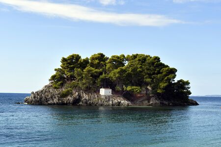 Greece, Epirus, chapel on tiny island at the village of Parga - located on Ionian sea is a preferred destination for vacationの写真素材
