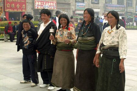 Lhasa, China - July 07, 2004: Unidentified Tibetians by pilgrimage on Yokhang Square in Tibetのeditorial素材