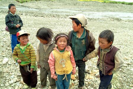 Tibet, China - July 9th 2004: Unidentified children in the rural area of Tingri tablelandのeditorial素材