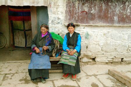 Gyantse, Tibet, China - July 09, 2004: Unidentified woman in traditional clothing and rosary at Gyantse monasteryのeditorial素材