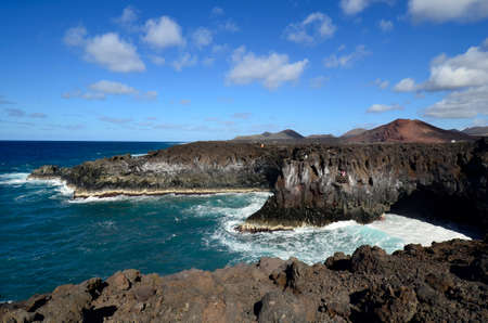 Lanzarote, Canary Island, Spain - January 16, 2012: Unidentified people on cliffs of Los Hervideros...
