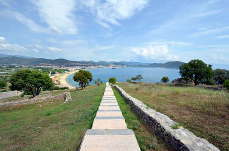 Greece, steps in ground of medieval castle Anaktoroupolis with view to beach in Nea Peramos on Aegean Seaのeditorial素材