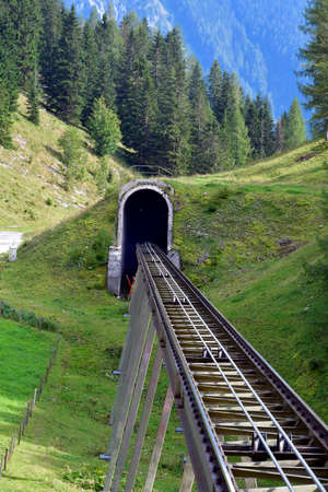 Austria, tunnel and track of the funicular to Wurzer Alm in national park Kalkalpen, Pyhrn-Priel region in Upper Austriaの写真素材