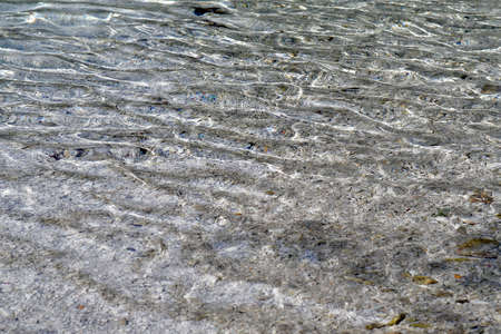 Austria, the clear water of the steyr river flows over pebbles in the creek bed in Kalkalpen...