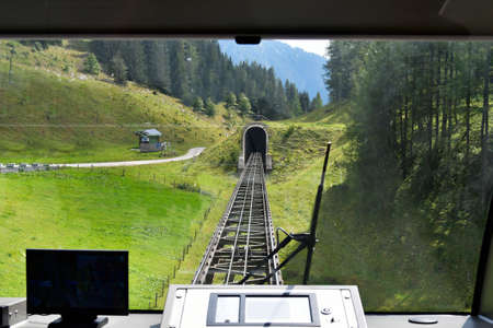 Austria, rails and tunnel of the funicular to Wurzer Alm in the Pyhrn-Priel holiday region, located in the Kalkalpen National Park in Upper Austriaの写真素材