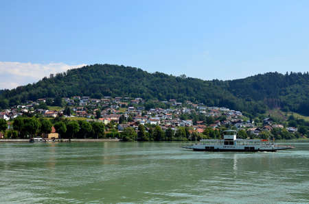 Obernzell, Germany - July 17, 2018: Ferry across the Danube River, a connection between Bavaria in Germany and Upper Austriaのeditorial素材
