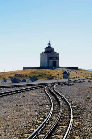 Austria, rails of the rack railway and Sisi chapel - built by Habsburg Emperor Franz Joseph in memory of his wife Empress Sisi on Schneeberg mountainの写真素材