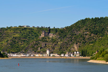St. Goarshausen, Germany - May 29, 2011: Different buildings and city tower with Castle Katz, ship on Rhine river in Rhineland-palatinateのeditorial素材