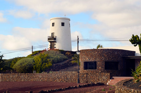Yaiza, Spain - January 16, 2012: Old windmill converted in a home on the Canary Island of Lanzaroteのeditorial素材