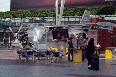 Munich, Germany - May 27, 2010: Unidentified people on Munich airport at old airplane converted into...