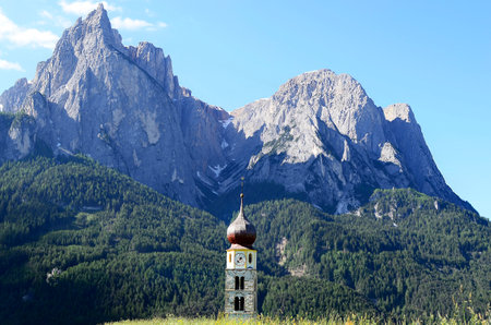 Seis, Italy - church spire and Punta Santner rock formation