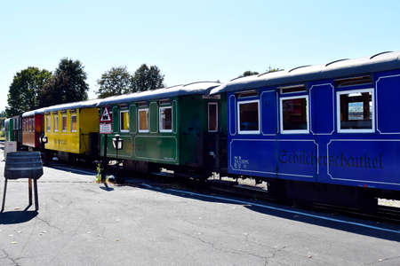 Stainz, Austria - September 23, 2021: Colorful wagons of the so-called Flascherlzug - bottle train -...