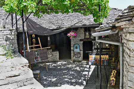 Monodendri, Greece - June 28, 2021: Courtyard with gift shop in old Monastery of Agia Paraskevi,...