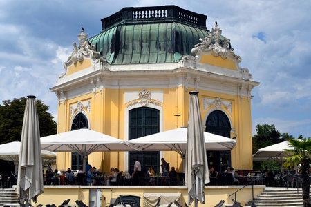 Vienna, Austria - August 01, 2022: Unidentified tourists and the so-called imperial pavilion in the zoo, now used as a cafe-restaurant- former summer residence of the Habsburg rulers and today a UNESCO World Heritage Site, world-famous tourist attraction のeditorial素材