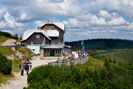 Hirschwang, Austria - August 10, 2022: Unknown hikers take a break at the mountain inn called Ottohaus on Rax mountain in Lower Austria, part of the Vienna Alpsのeditorial素材