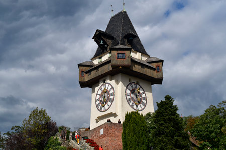 Graz, Austria - September 22, 2022: Unidentified tourists on Schlossberg hill with clock tower the landmark of Graz in UNESCO world heritage site of Graz, capital of Styriaのeditorial素材