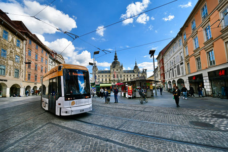 Graz, Austria - September 22, 2022: Town hall, market and public tram on main square in the capital city of Styriaのeditorial素材