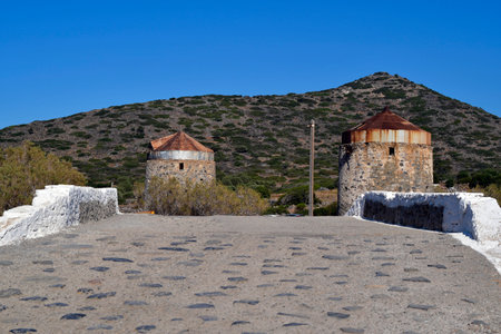 Greece, Crete, bridge to Kalydon peninsula aka Spinalonga peninsula and old windmillsの写真素材