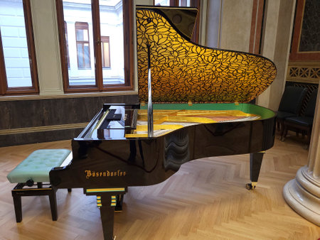 Vienna, Austria - March 20, 2023: The parliament of Austria one of the most imposing buildings along the Vienna Ringstrasse, the golden piano in a meeting room of the new renovated buildingのeditorial素材