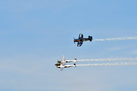 Zeltweg, Austria - September 03, 2022: Public airshow in Styria named Airpower 22, flight demonstration with two WWII fighter aircrafts, Chance Vought F4U-4 Corsair and Lockheed P-38 Lightningのeditorial素材