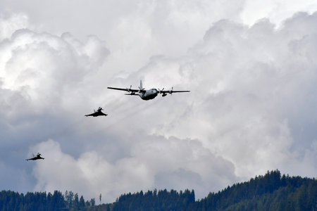 Zeltweg, Austria - September 03, 2022: Public airshow in Styria named Airpower 22, display with Hercules C130 and two Eurofighter Typhoon from Austrian air forceのeditorial素材