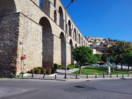 Kavala, Greece - June 13, 2023: Byzantine aqudesct Kamares from 16th century and the medieval castle, landmarks in the city on Aegean Seaのeditorial素材