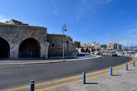Heraklion, Greece - October 14, 2022: The capital of Crete Island, old Venetian dockyards and promenade along small harborのeditorial素材