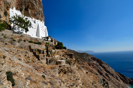 Amorgos Greece - September 09, 2025: The 9th-century monastery of Chozoviotissa is the island's highlight, an architectural gem built into a rock face with breathtaking views of the Aegean Seaの写真素材