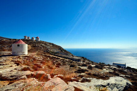 Greece - Medieval windmills on the hill in Chora on Amorgos Island with view to Aegean Seaの写真素材