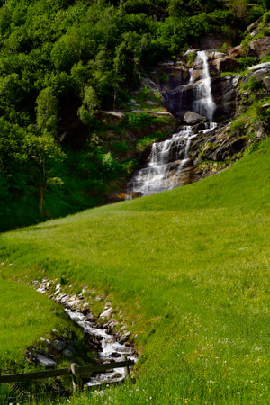 Mayrhofen, Austria - Waterfall at the Stillup reservoir in the Zillertal valley in the Austrian Alps in North Tyrol, a preferred destination for outdoor sportsの写真素材