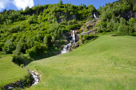 Mayrhofen, Austria - Waterfall at the Stillup reservoir in the Zillertal valley in the Austrian Alps in North Tyrol, a preferred destination for outdoor sportsの写真素材