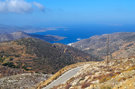 Amorgos Greece - September 09, 2025: View from the mountains to the Aegean Sea with the village of Katapolaの写真素材