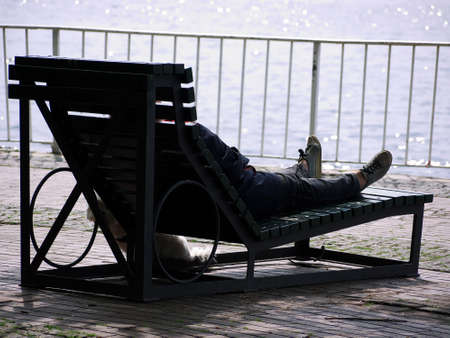 a person rests on a sunlounger の写真素材